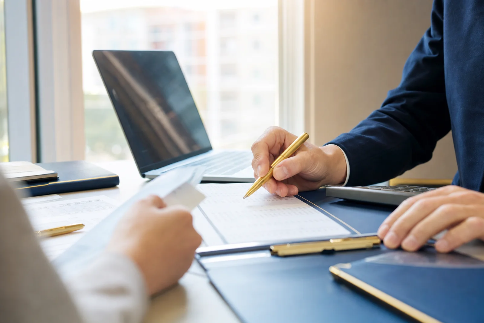 CPA reviewing bookkeeping records at Fort Wayne accounting firm desk